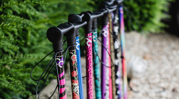A lifestyle shot of cool walking stick collection featuring rainbow zebra, skulls and pink walking sticks