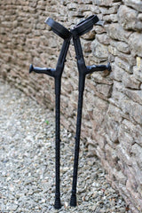 Black camo designed pair of crutches