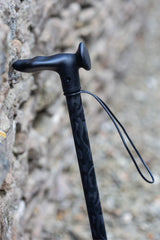 Black camo adjustable walking stick showing moulded handle with wrist strap