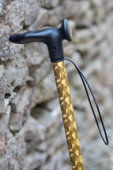 Gold chrome effect design on an adjustable walking stick with moulded handle