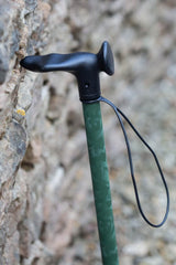 Green camo adjustable walking stick showing moulded handle and wrist strap