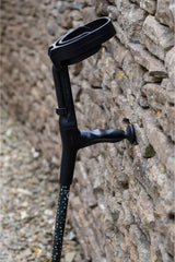 Dark Green Crutch covered in gold stars with moulded handle