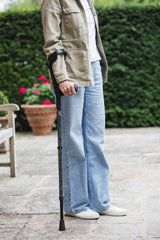 Green adjustable crutches with a star pattern