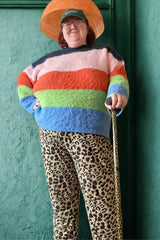 Person using a leopard print walking stick