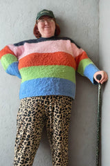 Person with a green adjustable walking stick with a star pattern