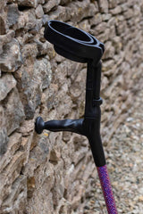 Cool Crutches in Purple Diamante Crystal leaning against stone wall