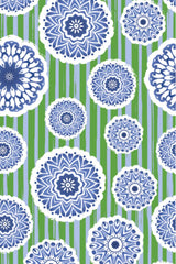Pattern of blue floral circles on a green and white striped background