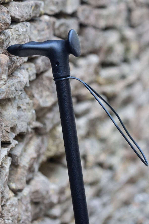 Black Leather Effect Walking Stick showing moulded handle with wrist strap