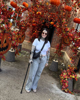 Woman using a black camouflage design Crutch form Cool Crutches