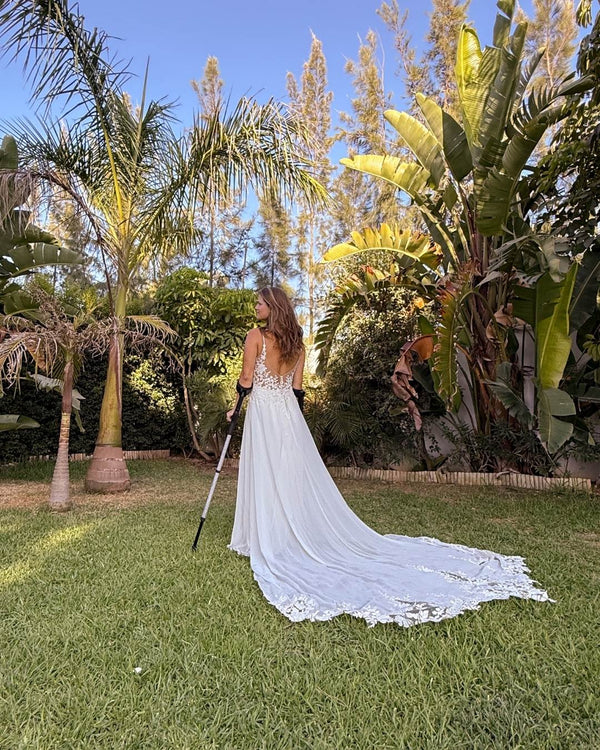 Bride at Wedding using Silver Glitter Crutches
