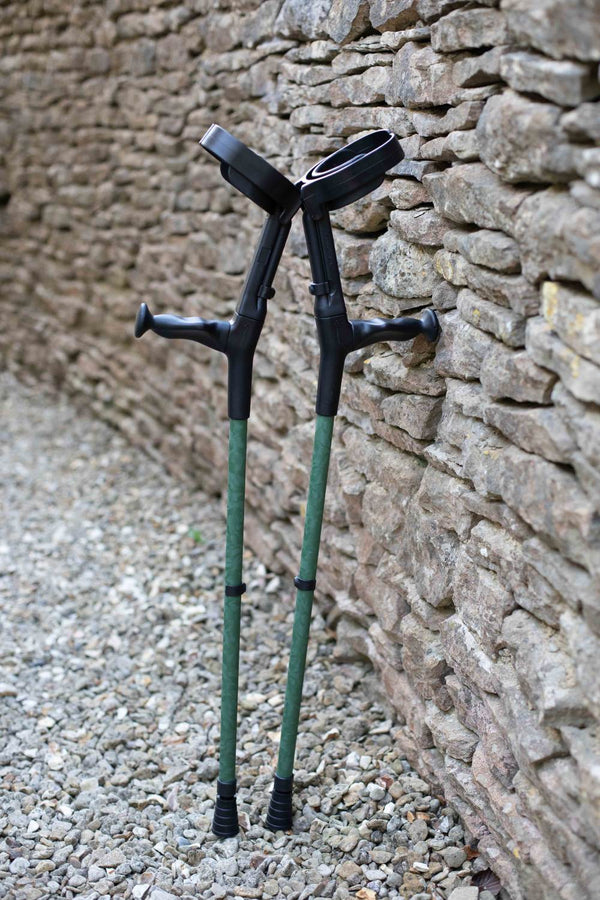 Green camo designed pair of adjustable crutches 