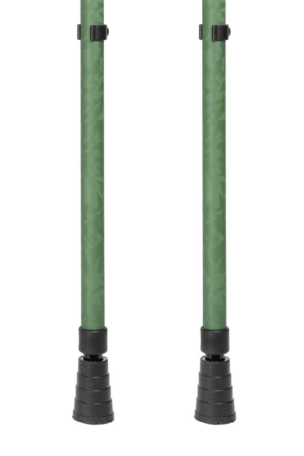 Bottom of green camo designed pair of adjustable crutches showing ferrules