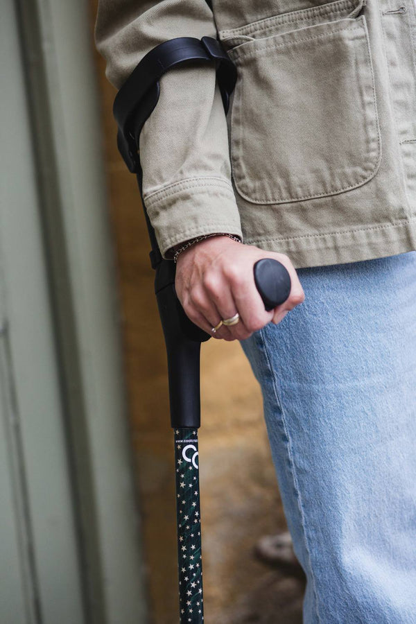 Green adjustable crutches with a star pattern 