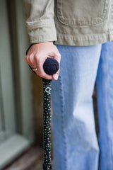 Green adjustable walking stick with a star pattern 