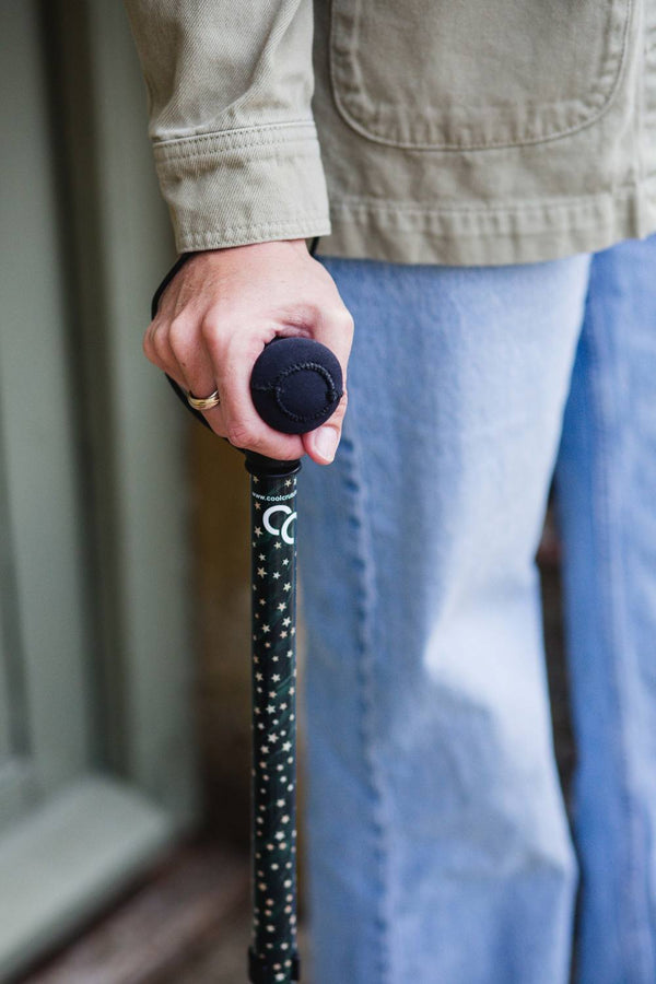 Green adjustable walking stick with a star pattern 
