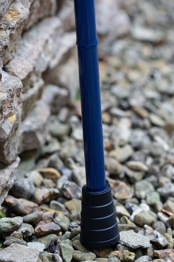 Navy Blue folding walking stick by cool crutches showing supportive ferrule