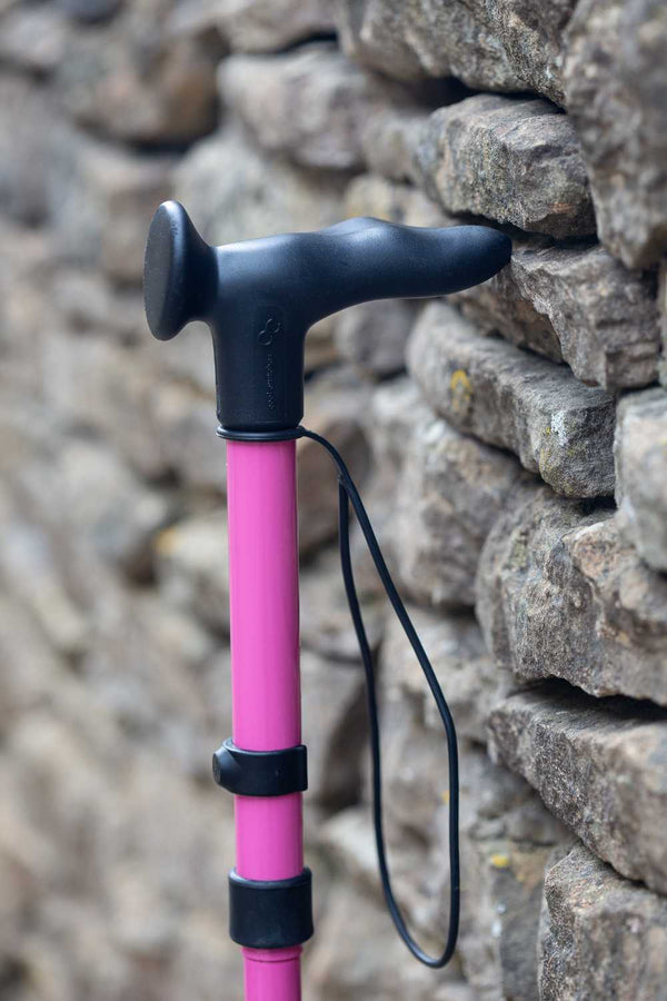 Pink folding walking stick by cool crutches with ergonomic handle