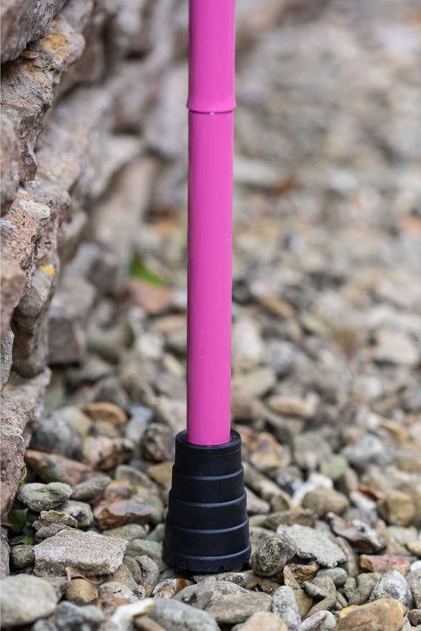 Pink folding walking stick by cool crutches with supportive ferrule
