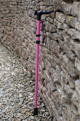 Pink folding walking stick by cool crutches with ergonomic handle, soft grip cover and ferrule