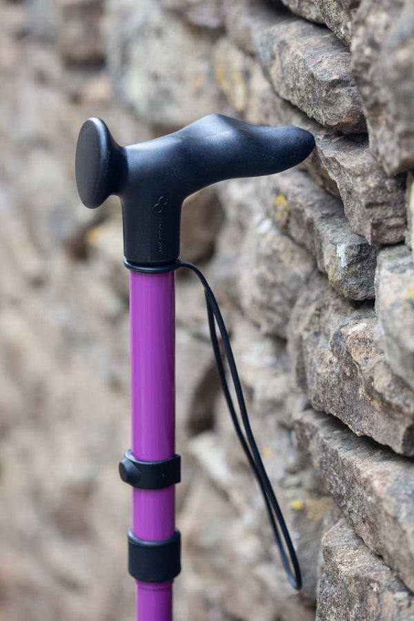 Purple folding walking stick by cool crutches with ergonomic handle