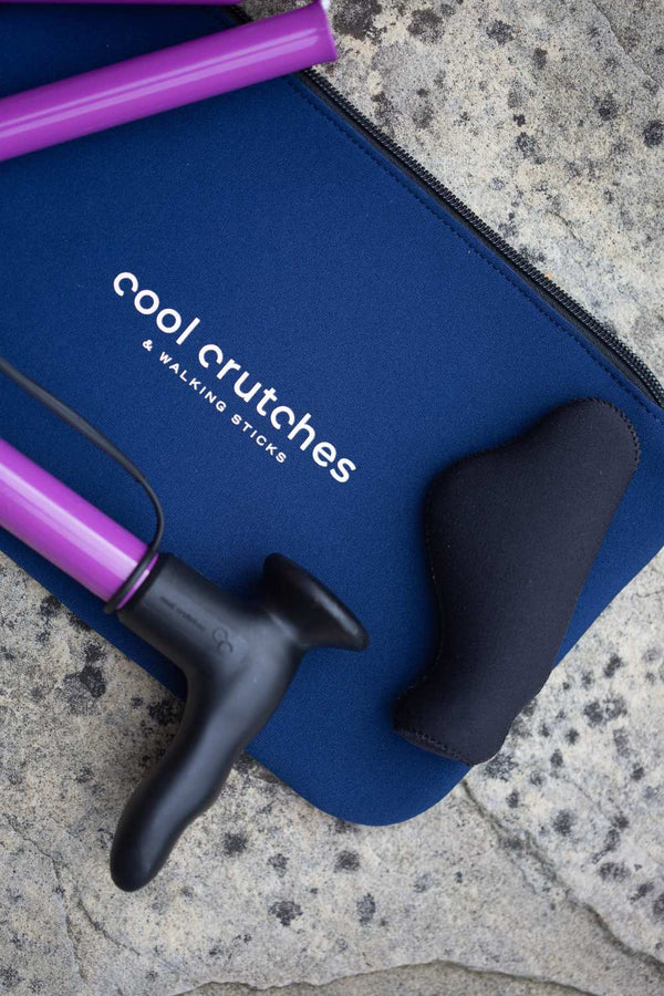 Purple folding walking stick by cool crutches with ergonomic handle, soft grip cover and neoprene travel bag