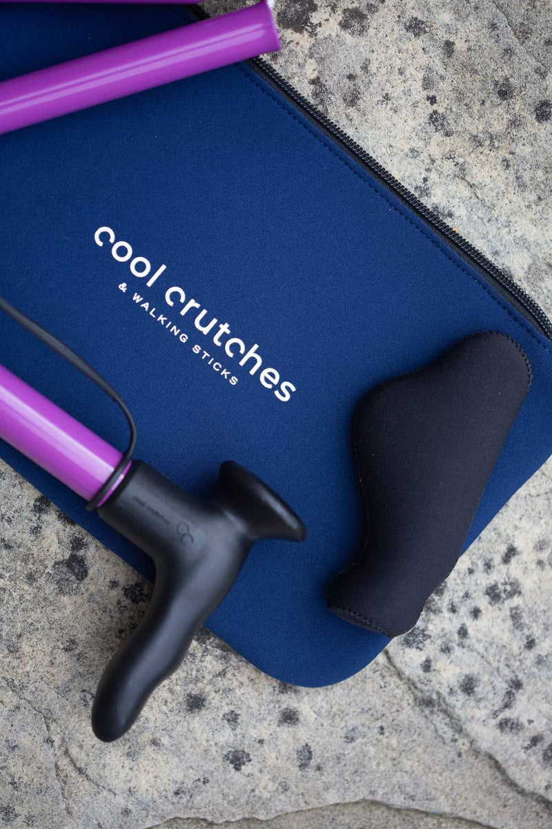 Purple folding walking stick by cool crutches with ergonomic handle, soft grip cover and neoprene travel bag